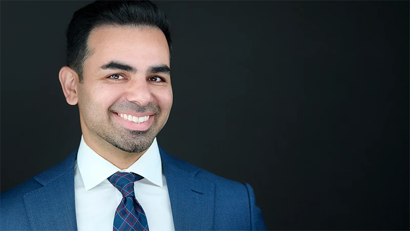 Ben Rahmani primary headshot with confident expression on a dark background