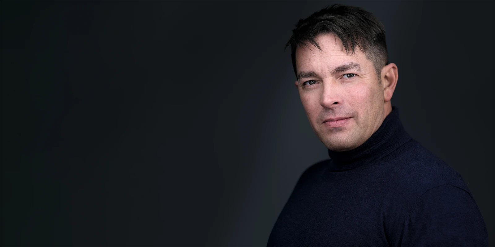 Davey Jones on a clean white background, wearing a suit and tie