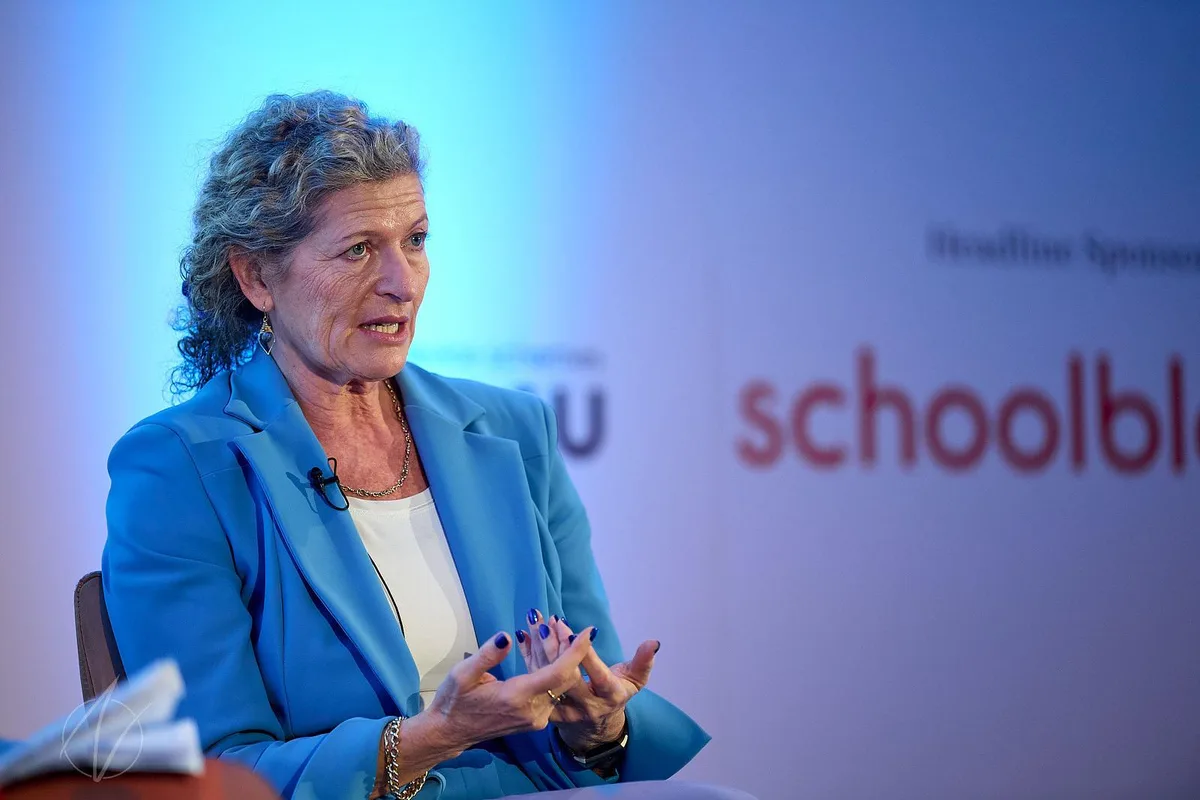 Speaker in blue blazer during a panel discussion