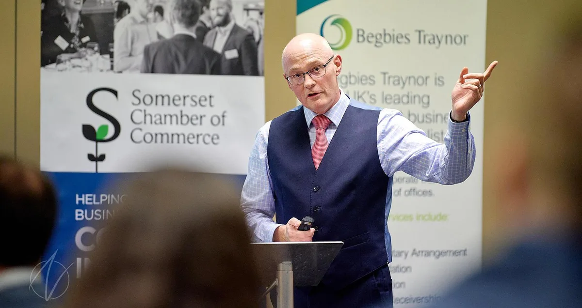 Speaker at lectern addressing an audience at a Somerset Chamber of Commerce business event