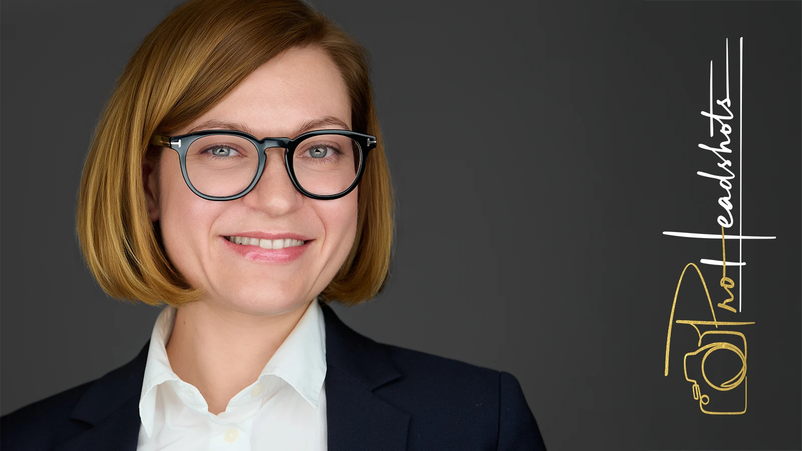 Corporate headshot of an executive in a dark red suit, representing authority and approachability