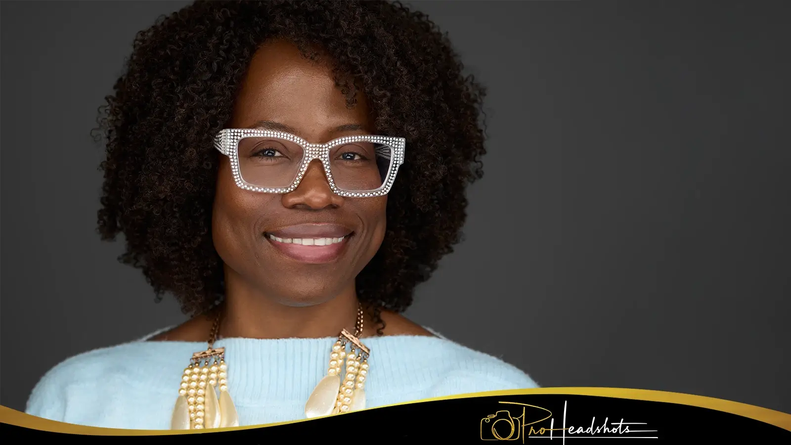 Professional looking at their newly taken LinkedIn profile photos with satisfaction