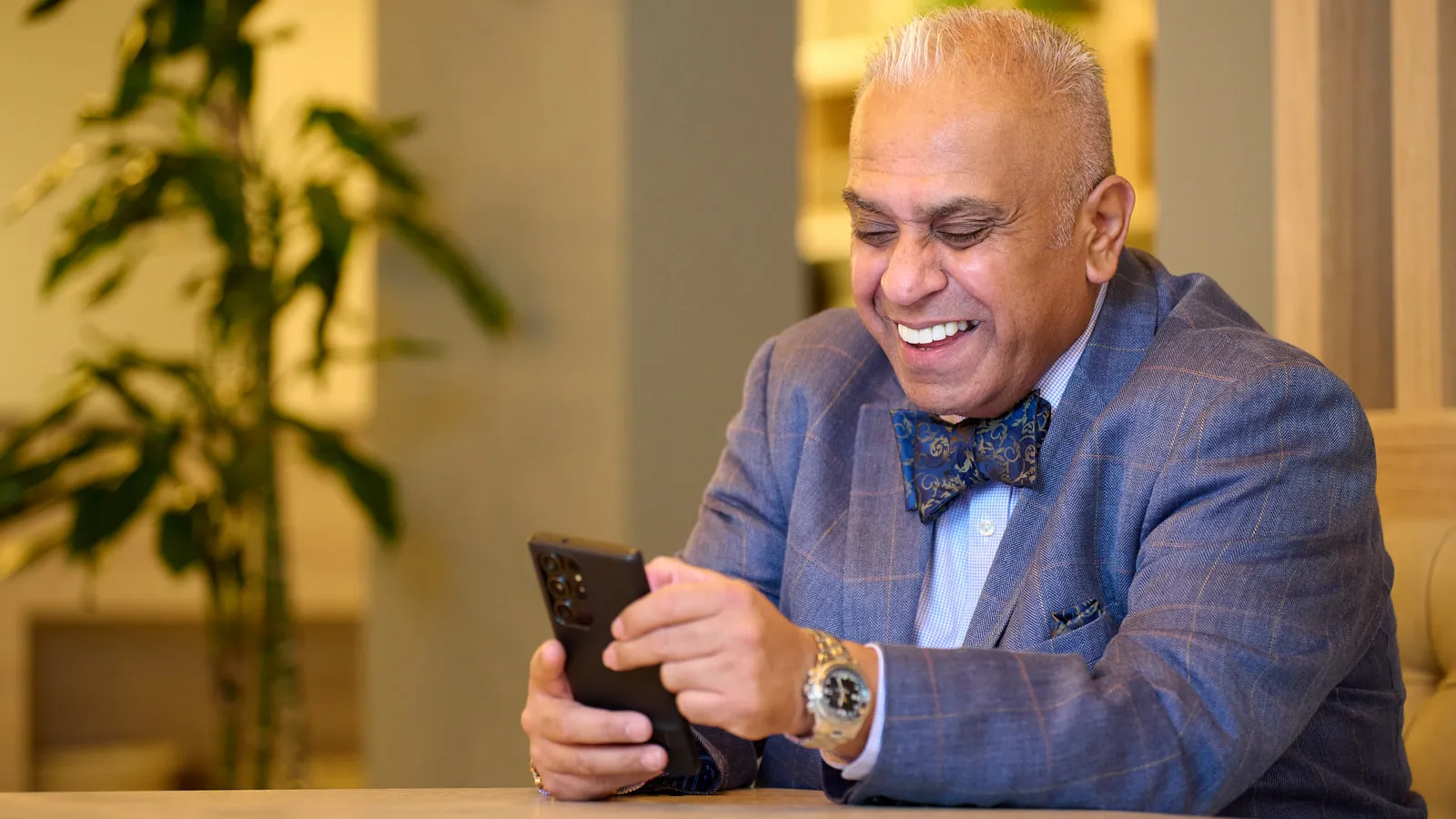 Christian laughing during a conversation, showing a relaxed and approachable side