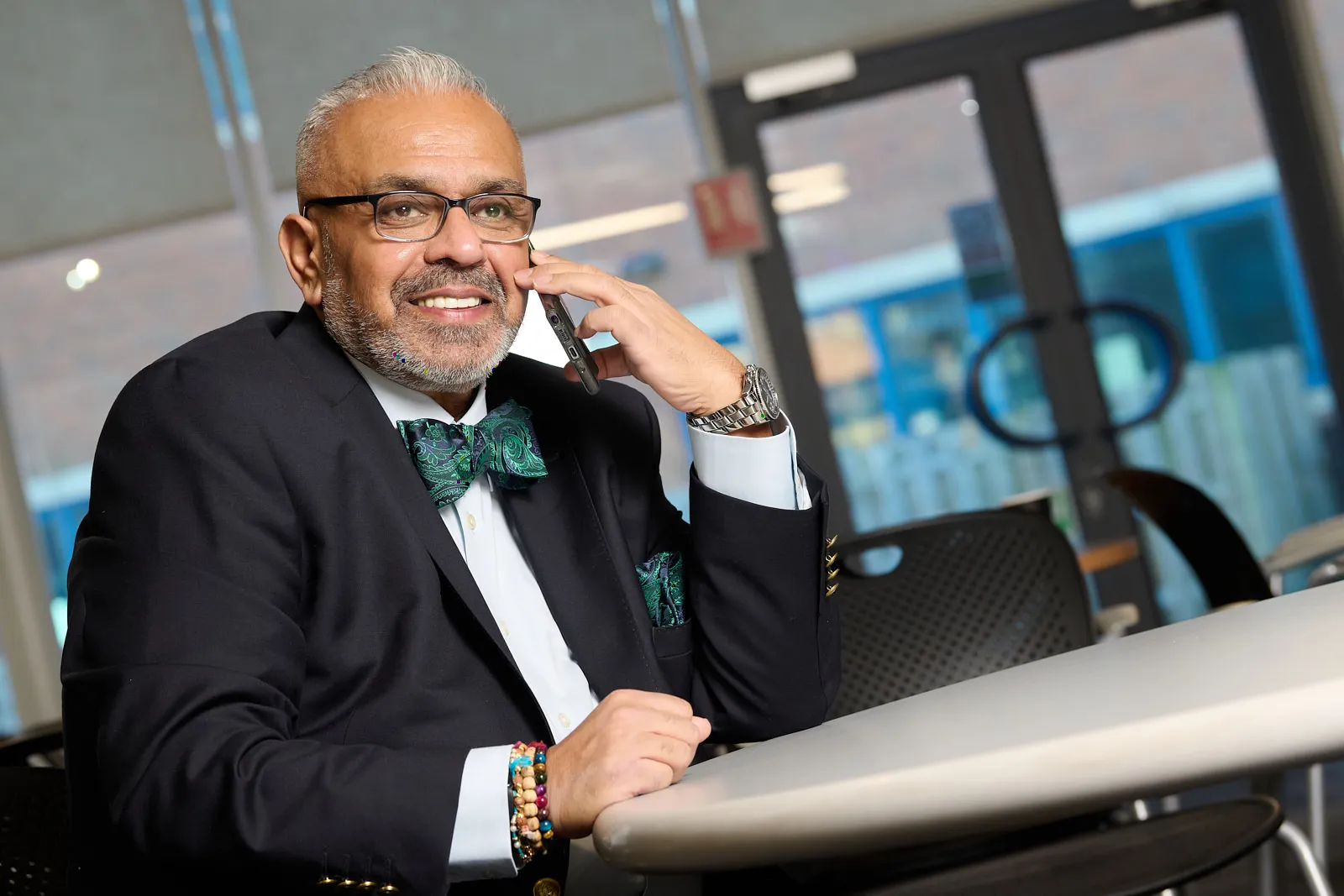 Christian in a boardroom scene framed from a different angle, adding variety for social posts