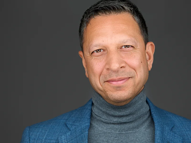 Executive headshot showing confident leadership and professional approachability in Swindon