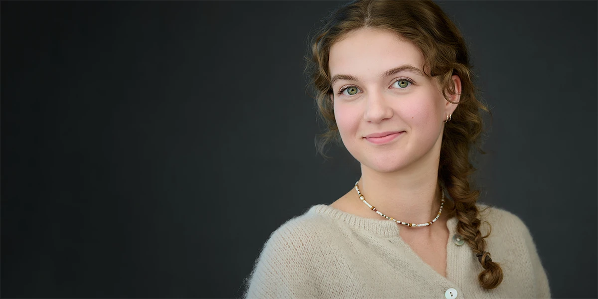 Relaxed on-location headshot session showing a calm, confident expression in an office setting