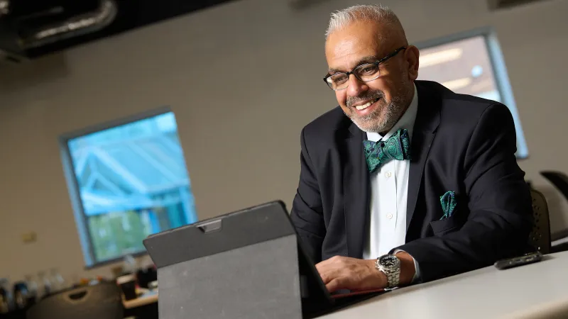 Professional photographed in a natural outdoor setting during a personal branding session