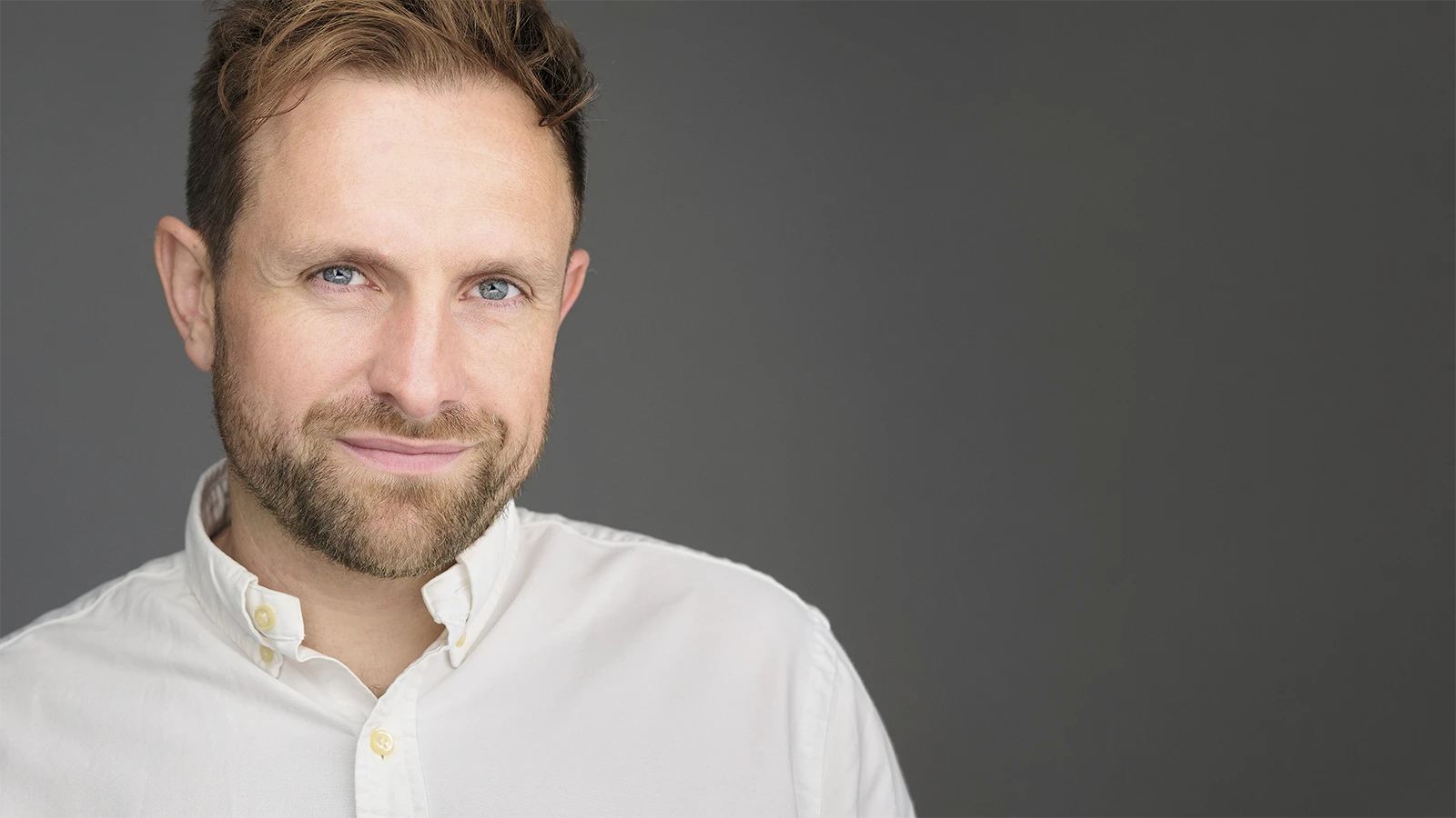Corporate team members with consistent professional headshots photographed together