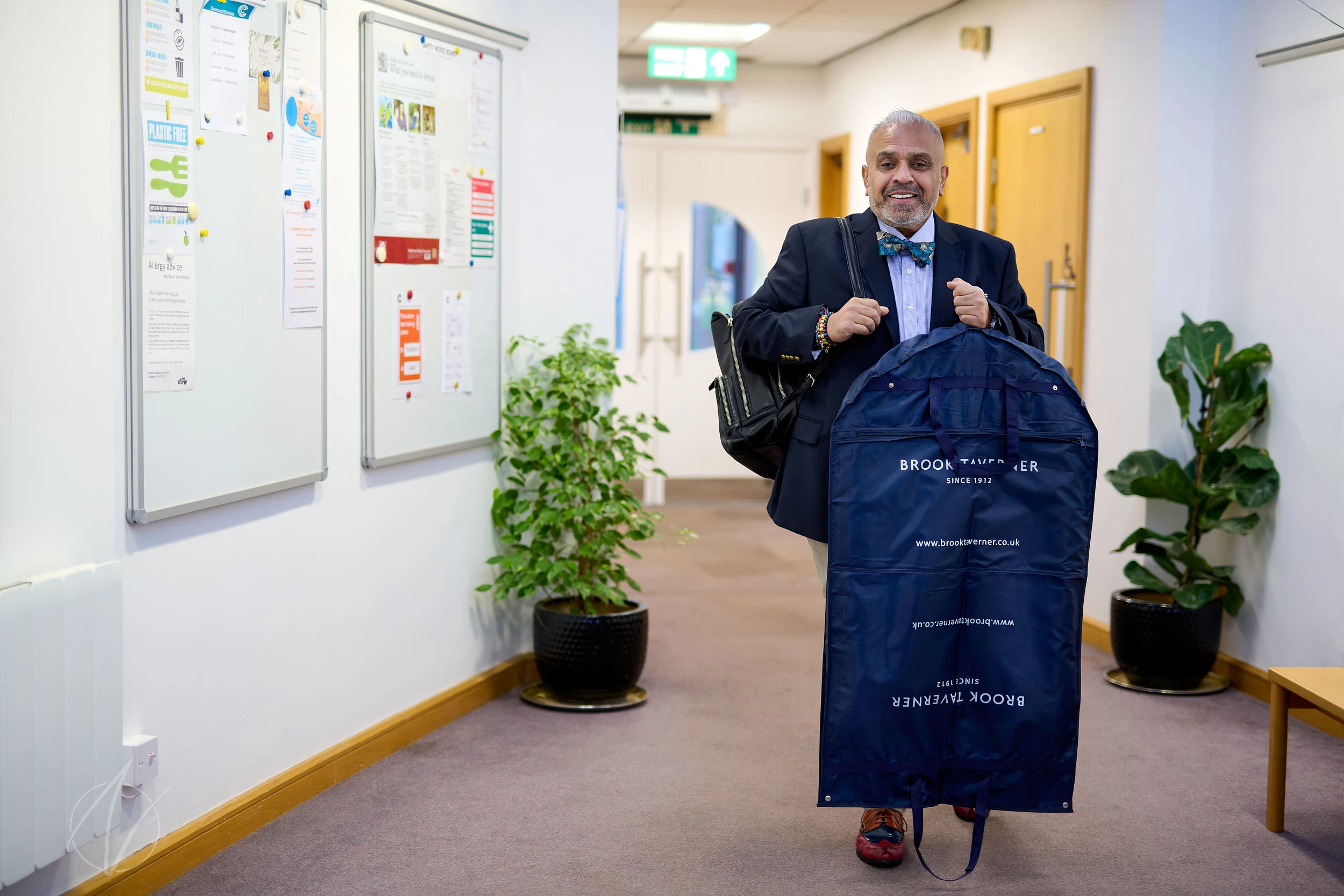 Christian Kumar personal branding photography session: venture builder arriving at a business location, carrying a suit bag