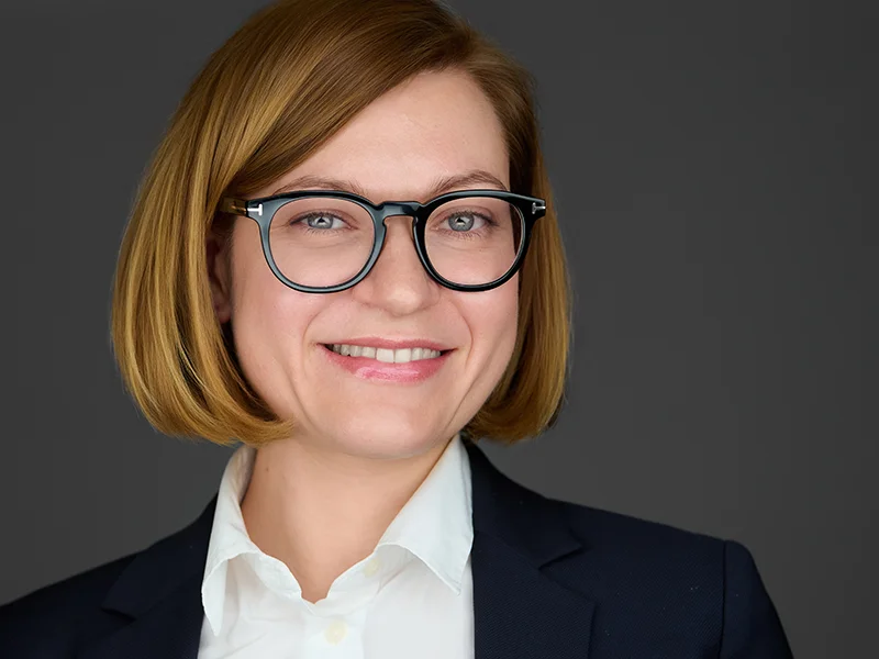 HR director with confident smile in classic blazer for her business headshots